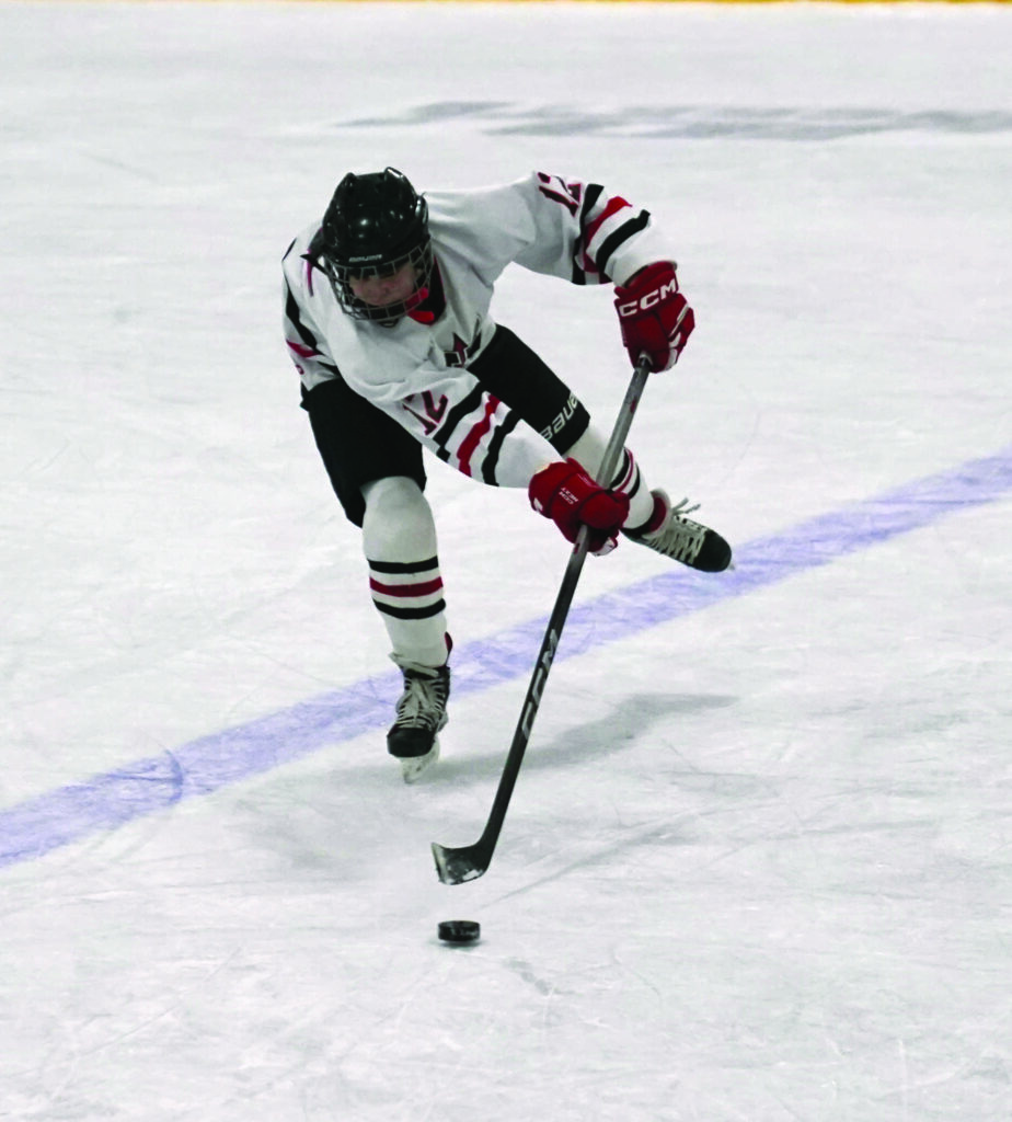 Mike Carroll/Plainsman
Huron’s Leo Sarvis passes the puck during Saturday’s game. 