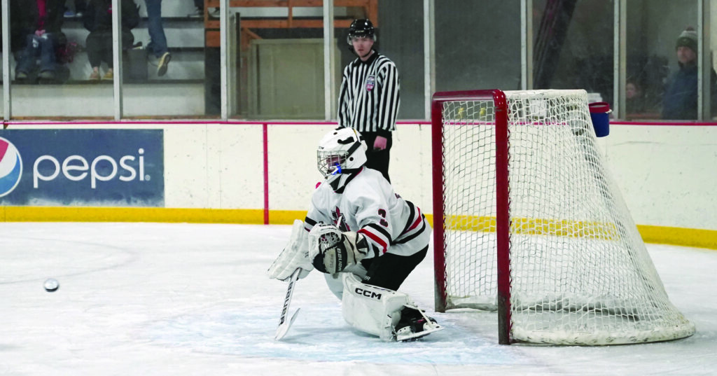 Mike Carroll/Plainsman
Huron goalie Emerson Bronson eyes the incoming puck during the semifinals against Yankton on Saturday at Bergman Arena. 