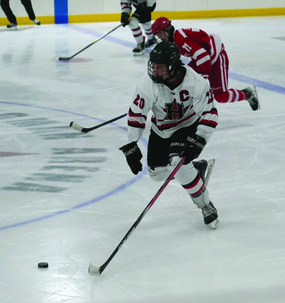 Huron’s Monte Bogh skates with the puck during a game against Brookings on Saturday at Bergman Arena. 