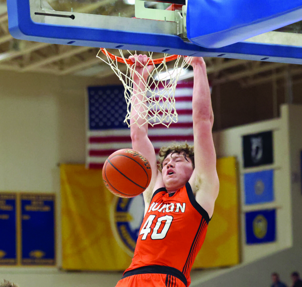 JOHN DAVIS/SDSPORTSCENE.COM
Huron’s Davis Chase follows through with a dunk during Thursday night’s game against Aberdeen Central at the Golden Eagles Arena in Aberdeen. 