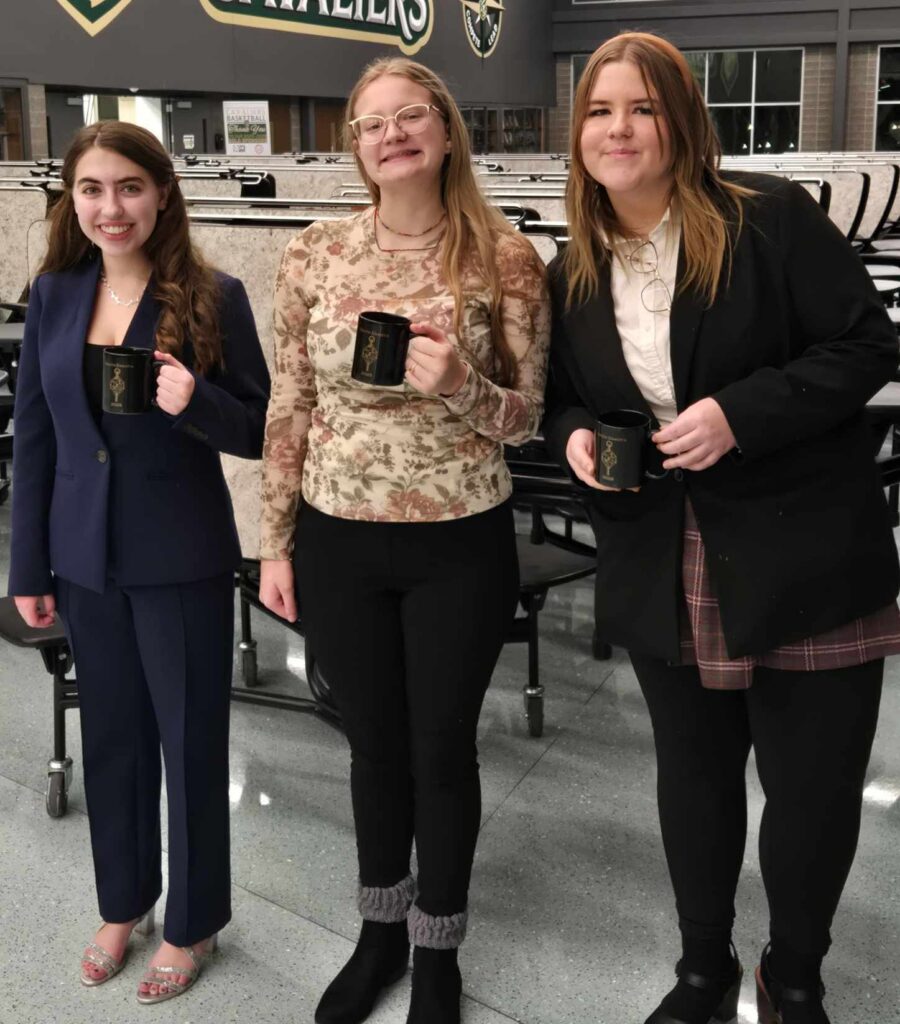 Courtesy photo Posing at the qualifying tournament are Huron speech and debate members (L to R) Emmersyn McGillvrey, Mara Pell, and Sophie Mehling