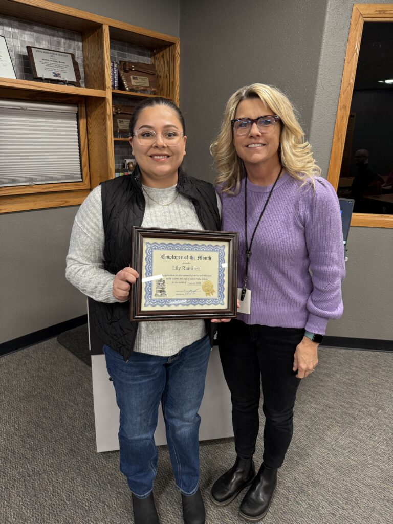 Lily Ramirez, left, SPED para educator at Madison 2-3 Center, was recognized as the January 2026 classified employee of the month. She is presented her certificate by Heather Rozell.