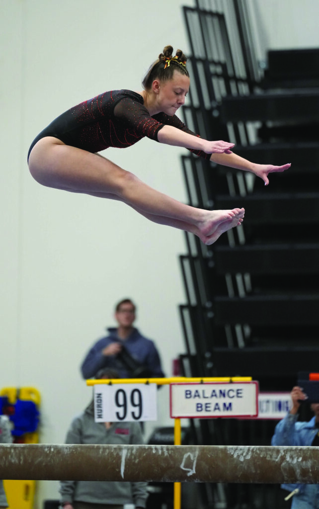 COURTESY OF SD PUBLIC BROADCASTING Huron’s Ellie Puterbaugh competes on the balance beeam during the Class AA Individual Competition in the State Gymnastics Meet on Saturday in Mitchell.