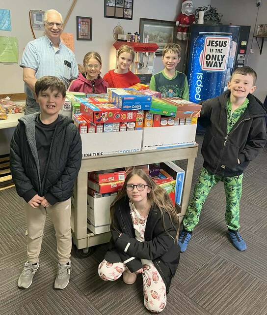 Elementary Student Council delivered the boxes of cereal to the Salvation Army Food Pantry. Left to right, front row - Edger Aldana, Kaebrey Brown and Micah Blue; Back Row - Salvation Army representative, Rina Frankfurth, Bekah Dunsworth and Jonathan Bornitz