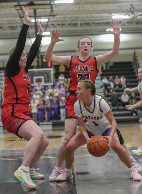 Photos courtesy of Craig Wollman Highmore-Harrold teammates Addison McDonnell, left, and Jada Baloun defend against Lydia Austin of Centerville during their Class B SoDak 16 game Thursday at the Mitchell High School gym.