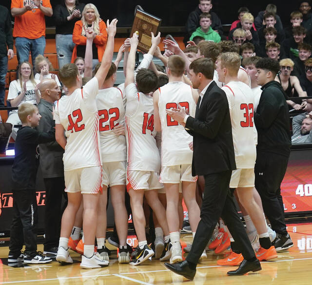 Mike Carroll/Plainsman The Huron team celebrates its SoDak 16 victory over Pierre on March 7.