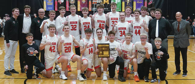 Mike Carroll/Plainsman The Huron Tigers after their SoDak 16 win over Pierre. Back row, L to R, coach Dawson Schmidt, coach Spencer Stahly, coach Jay Ellwein, Jeremy Hofer, Nolan Stahly, Anderson Porisch, Chase Schuchhardt, Davis Chase, Blake Ellwein, Ty Kleinsasser, Regan Derksen, Bryson North, Carter Porisch, Malcom Williams, coach Tre Henderson, head coach Tim Buddenhagen. Front row, L to R, student manager Brantley Block, Neil Salmen, Myles Ellwein, James Shoultz Jr., Mason Jurgens, Oakley Anderson, Joshua Gilbert, student manager Matthew Salmen, and student manager Laken Vanzee.