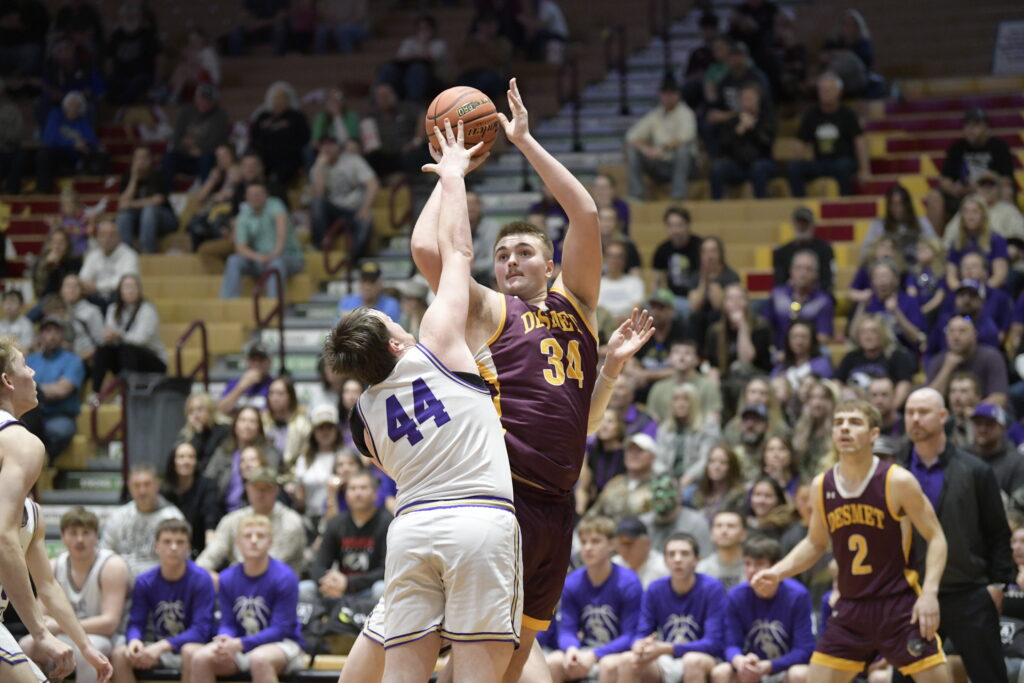COURTESY OF SDPB De Smet’s Grant Wilkinson puts up a shot against James Miles of Sully Buttes during their game in the consolation semifinals of the Class B State Tournament on Friday at the Barnett Center in Aberdeen.