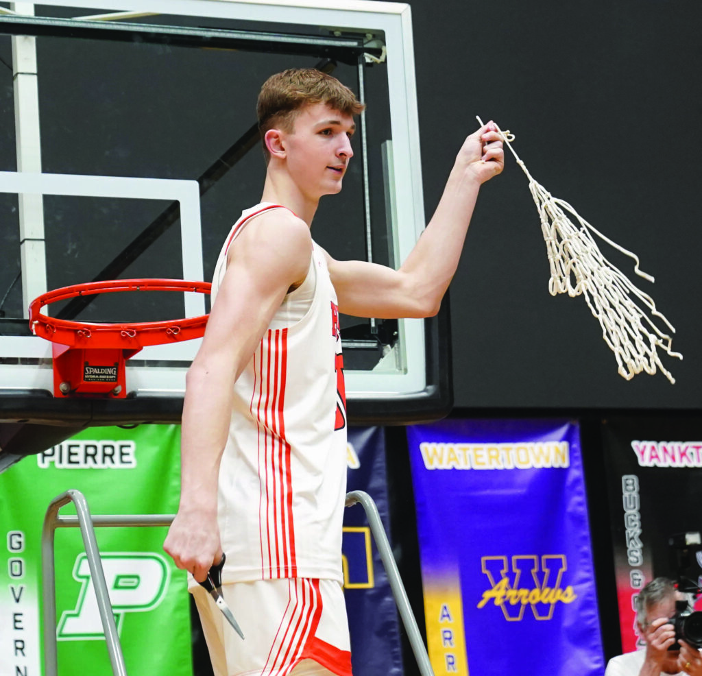 Mike Carroll/Plainsman
Blake Ellwein displays the net after making the final cut to take it down after Saturday’s game.