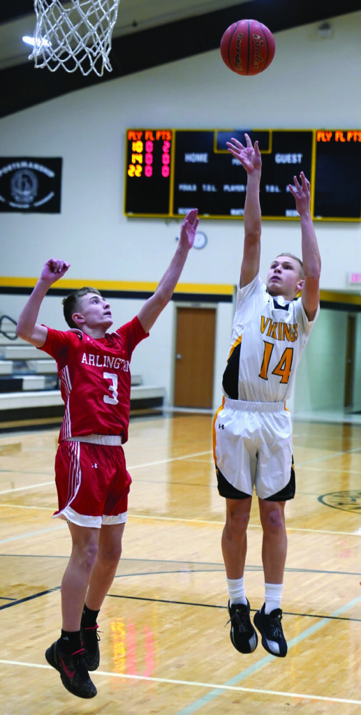 MIKE CARROLL/PLAINSMAN
James Valley Christian’s Noah Fast puts up a jumper in the paint against Arlington’s Trysten Huntimer during a Region 2B play-in game Monday at JVC gym. 