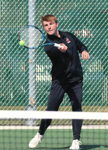 COURTESY OF JOEL BERGESON Hurons Riley Winegar returns the ball during a No. 5 singles match against Kerrick Zhang of Brookings on Tuesday at Huron Courts.