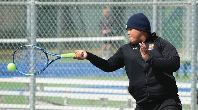 COURTESY OF JOEL BERGESON Hurons Ywa Hae Moo plays the ball on the baseline aagianst Ted Lin of Brookings in a No. 4 singles match on Wednesday at Huron Courts.