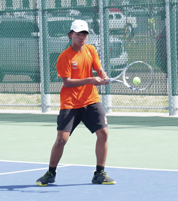Mike Carroll/Plainsman Hurons Htoo Zan plays a shot during a No. 1 doubles match against Aberdeen Central on Thursday at Huron Courts.