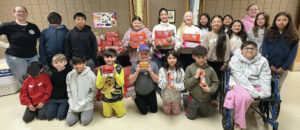 Holy Trinity School Rally for a Cause benefits Heartlant Region United Way backpack program