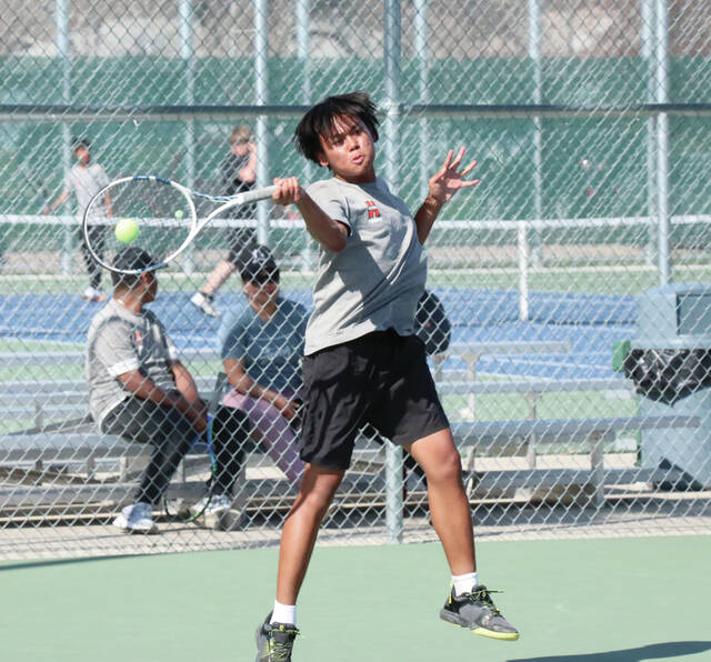 Photo courtesy of Joel Bergeson Hurons Htoo Zan plays a shot on the baseline during a No. 1 singles match against Milbank on Tuesday at Huron Courts.