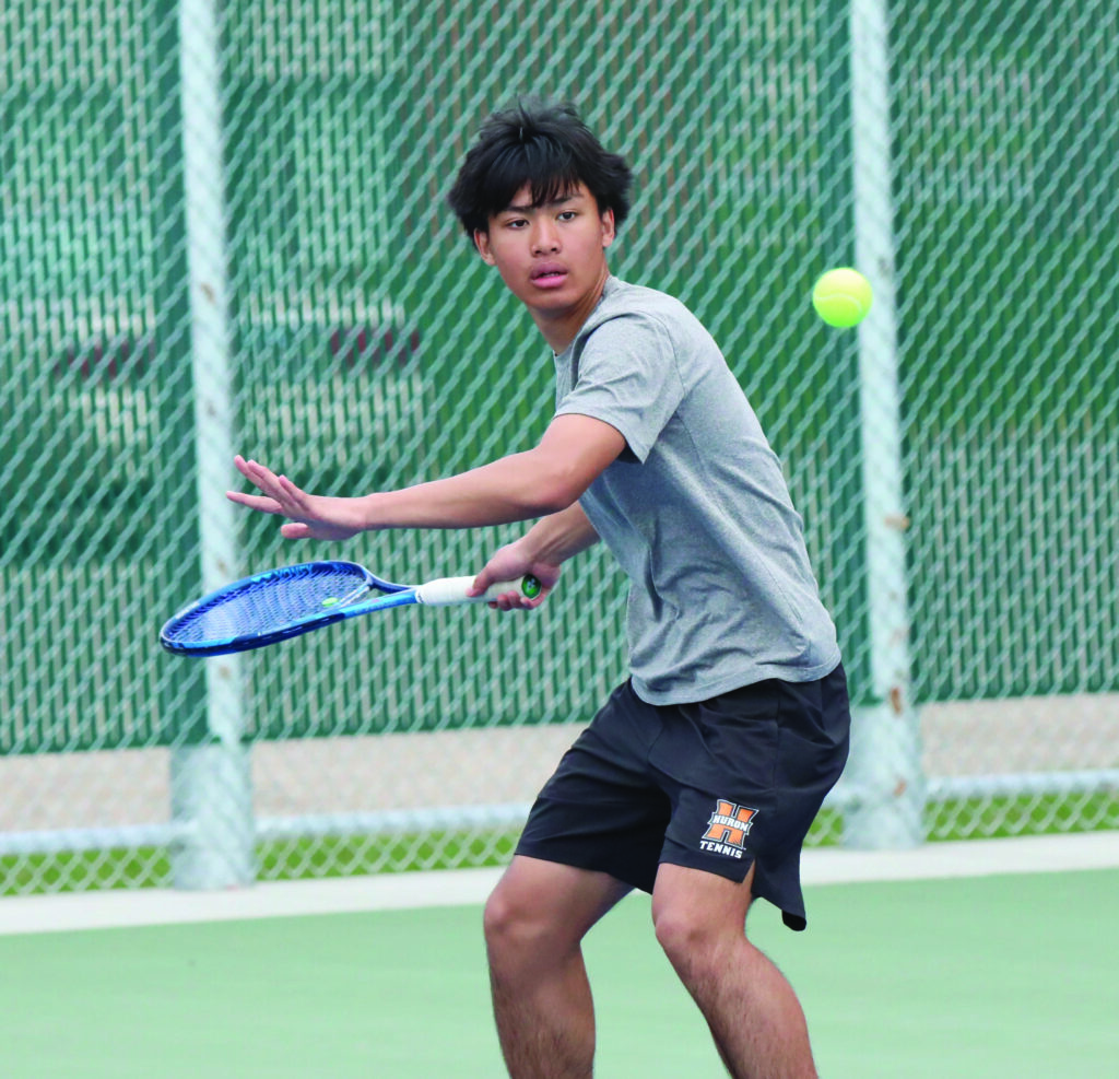 courtesy of joel bergeson Huron’s Jim Wah concentrates on the ball during a No. 3 doubles match on Monday at Huron Courts.