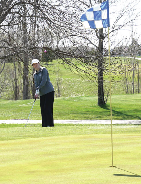 Mike Carroll/Plainsman Addy Baruth of Sanborn Central/Woonsocket chips on to the green during the 281 Conference Tournament on Thursday at Broadland Creek Golf Course.