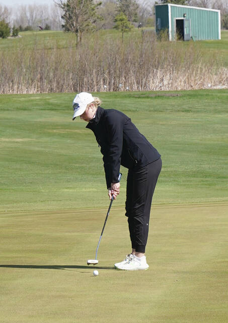 MIKE CARROLL/PLAINSMAN Belle Niederbaumer of James Valley Christian putts on the No. 13 green during the 281 Conference Golf Tournament on Thursday at Broadland Creek Golf Course.