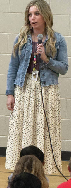 Benjamin Chase/Plainsman Krissa Korkow gets emotional as she speaks to the gathered student body at Buchanan K-1 Center Tuesday morning.