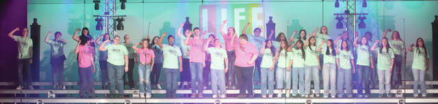 The Huron High School concert choir sings during their teenage rebellion portion of Thursday nights POPS concert at the Huron High School Auditorium.
                                 Benjamin Chase/Plainsman