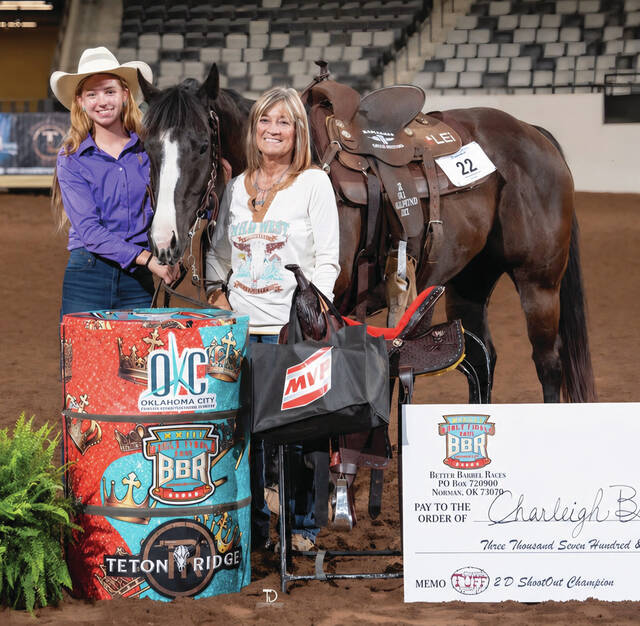 CONTRIBUTED Charleigh Brewer of Wessington, along with her grandmother, Jill Hins of Huron, pose following her victory in the BBR World Finals Shoot OUt Race in Oklahoma City.