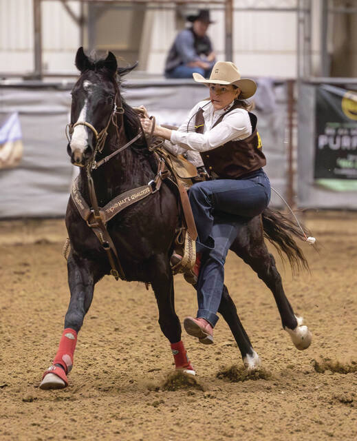 COURTESY OF THE UNIVERSITY OF WYOMING Layni Stevens of St. Lawrence competes in goat tying for the University of Wyoming during a collegiate rodeo this season.